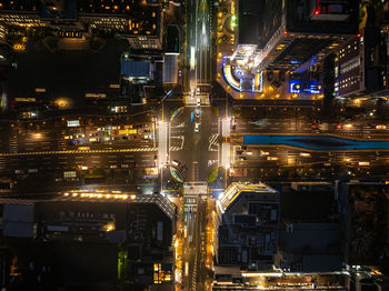 High angle view of illuminated buildings in city at night