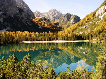 Scenic view of lake and mountains against sky