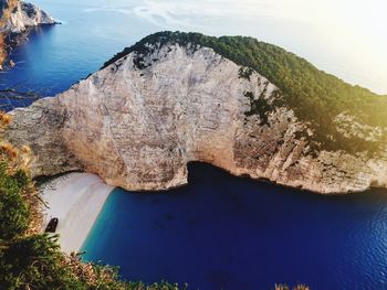 High angle view of rocks by sea