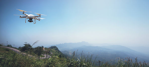 Low angle view of airplane flying against sky