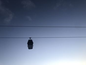 Low angle view of cables against sky