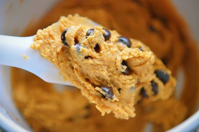 Close-up of spoon with batter and chocolate chips