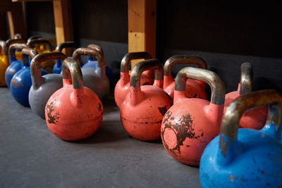 Colorful kettlebells in gym on the floor