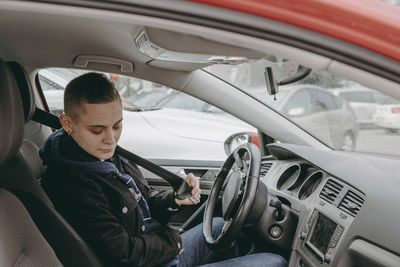 Woman sitting in car