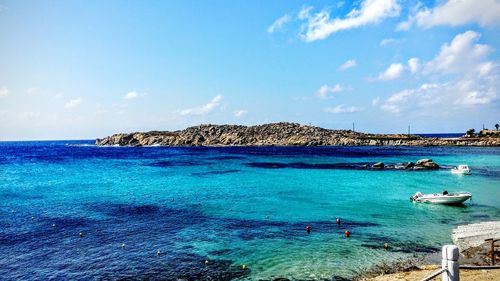 Scenic view of sea against blue sky