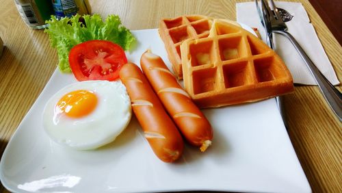 Close-up of fresh breakfast served in plate on table