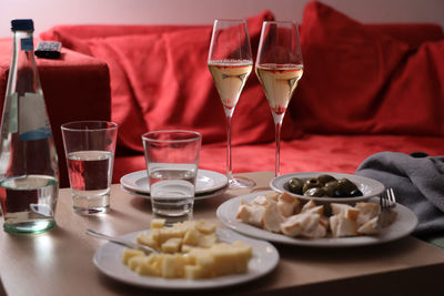 Romantic dinner for two with wine, cheese and olives.