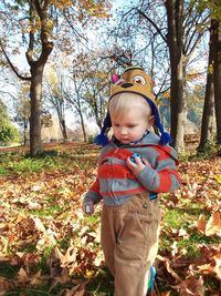 Full length of boy in park during autumn