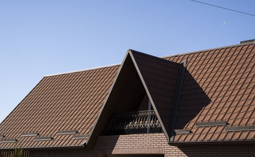 Low angle view of building against clear blue sky