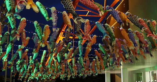 Low angle view of decorations hanging on ceiling of building