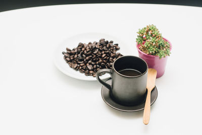 High angle view of breakfast on table against white background