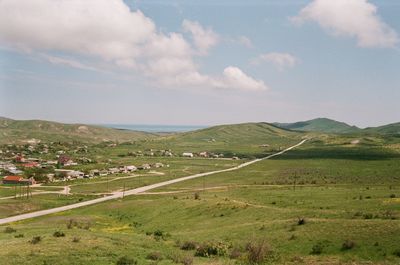 Scenic view of agricultural field against sky