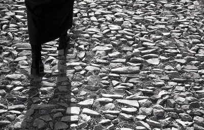 Low section of person standing on rock