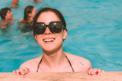 Portrait of woman swimming in sea