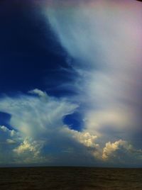 Scenic view of landscape against cloudy sky
