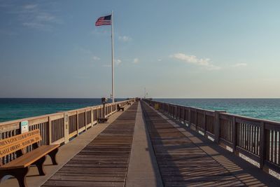 Pier over sea against sky