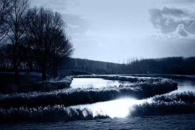 Scenic view of river against sky