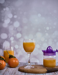 Orange juice in glass on table