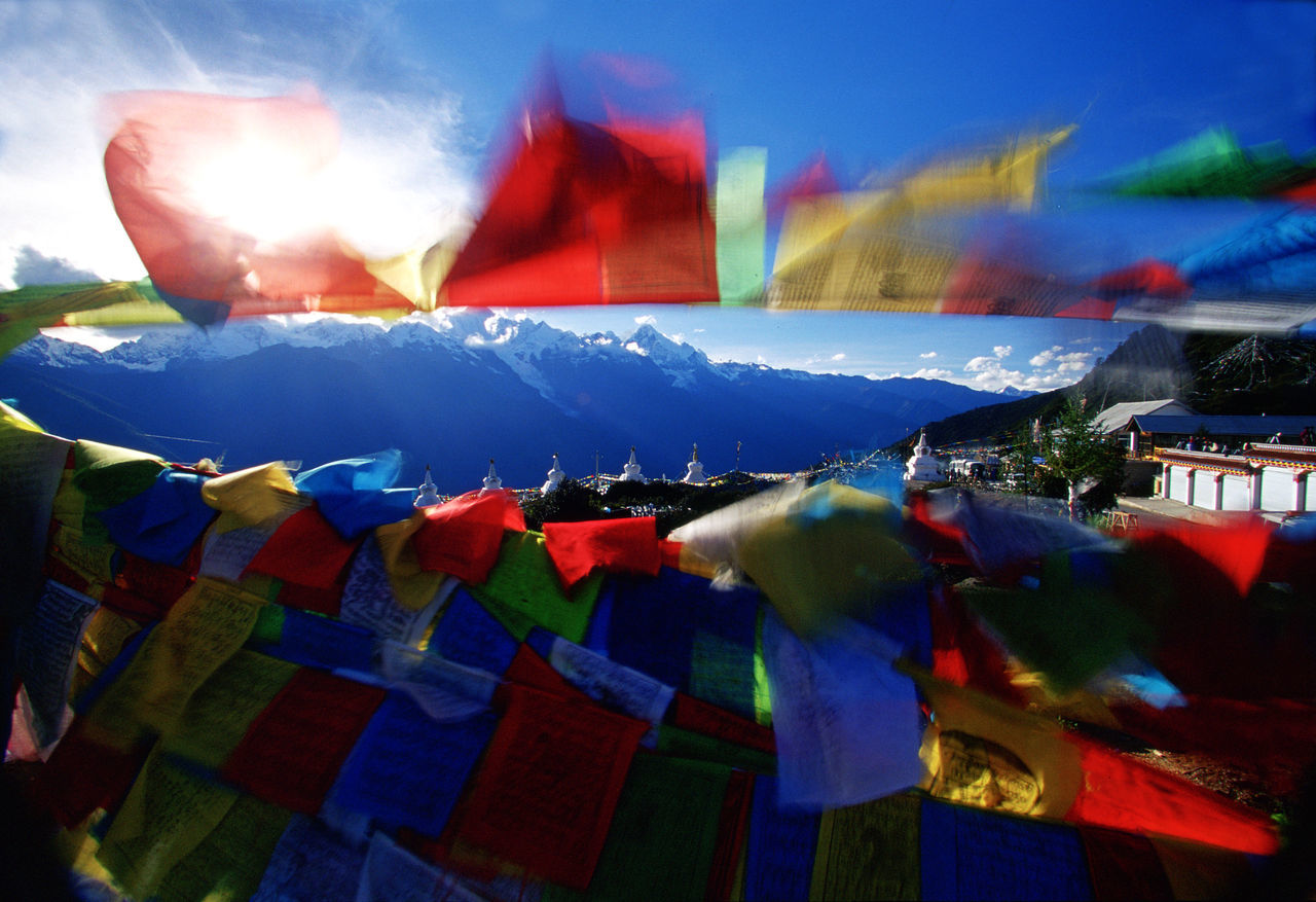 multi colored, sky, nature, flag, event, celebration, tradition, cloud, outdoors, architecture, arts culture and entertainment, religion