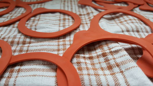 Close-up of rubber objects on tablecloth