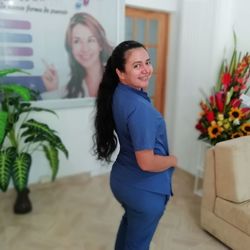 Happy woman standing at home