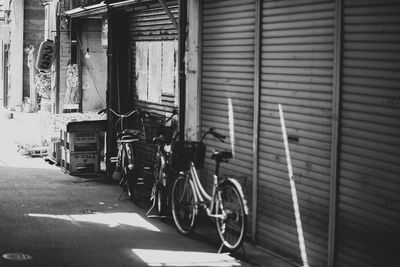 Bicycles parked against building