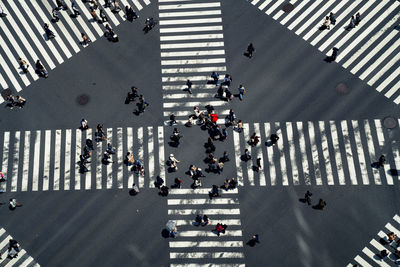 High angle view of people crossing road