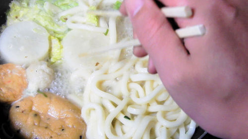 Close-up of hand holding food