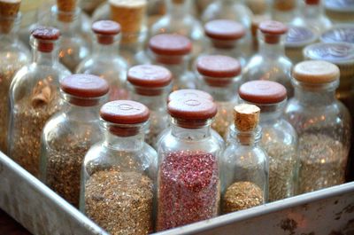 Close-up of glitters in bottles