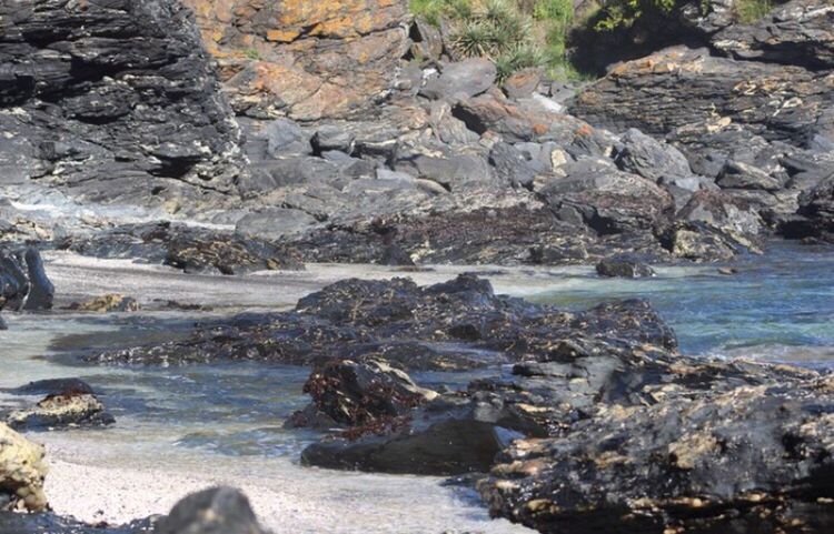 water, rock - object, scenics, tranquil scene, stone - object, tranquility, river, beauty in nature, rock formation, nature, flowing, non-urban scene, shore, rock, day, rocky, sea, stream, geology, outdoors, remote, stone, waterfront, rugged, vacations, eroded, physical geography, no people