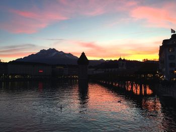 Scenic view of river at sunset