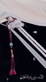 Close-up of chain hanging on rope