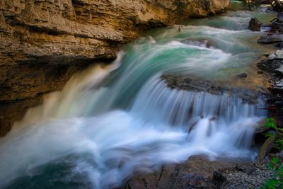 Scenic view of waterfall in forest