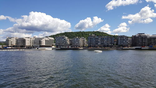 View of residential buildings against cloudy sky