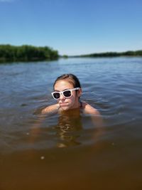 Portrait of man swimming in lake