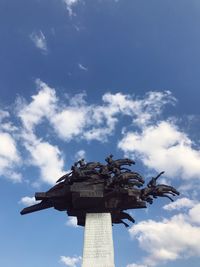 Low angle view of statue against sky