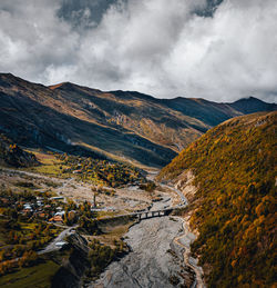 Scenic view of landscape and mountains against sky