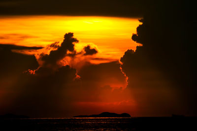 Scenic view of sea against romantic sky at sunset