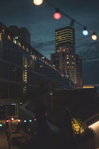 Illuminated street and buildings at night