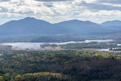 Scenic view of landscape and mountains against sky