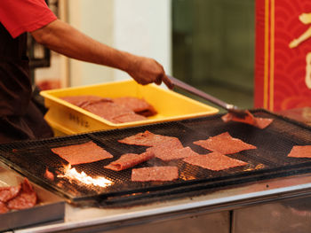 Midsection of man preparing food on table