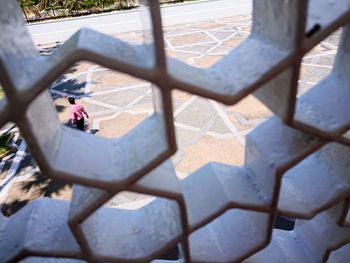 High angle view of man standing on footpath