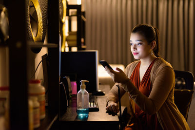 Young woman using mobile phone