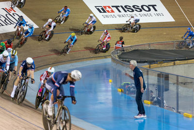 High angle view of people riding bicycle on street