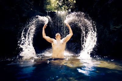 Man swimming in pool