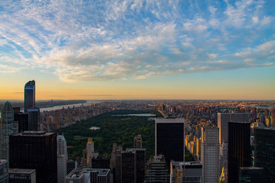 Aerial view of city at sunset