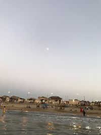 Scenic view of sea against clear sky at night