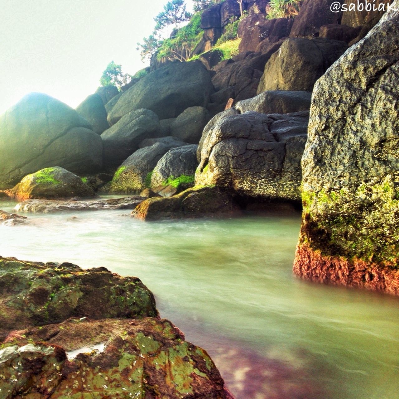 water, rock - object, rock formation, scenics, beauty in nature, tranquil scene, rock, tranquility, nature, cliff, sea, idyllic, tree, river, day, non-urban scene, mountain, waterfall, clear sky, geology