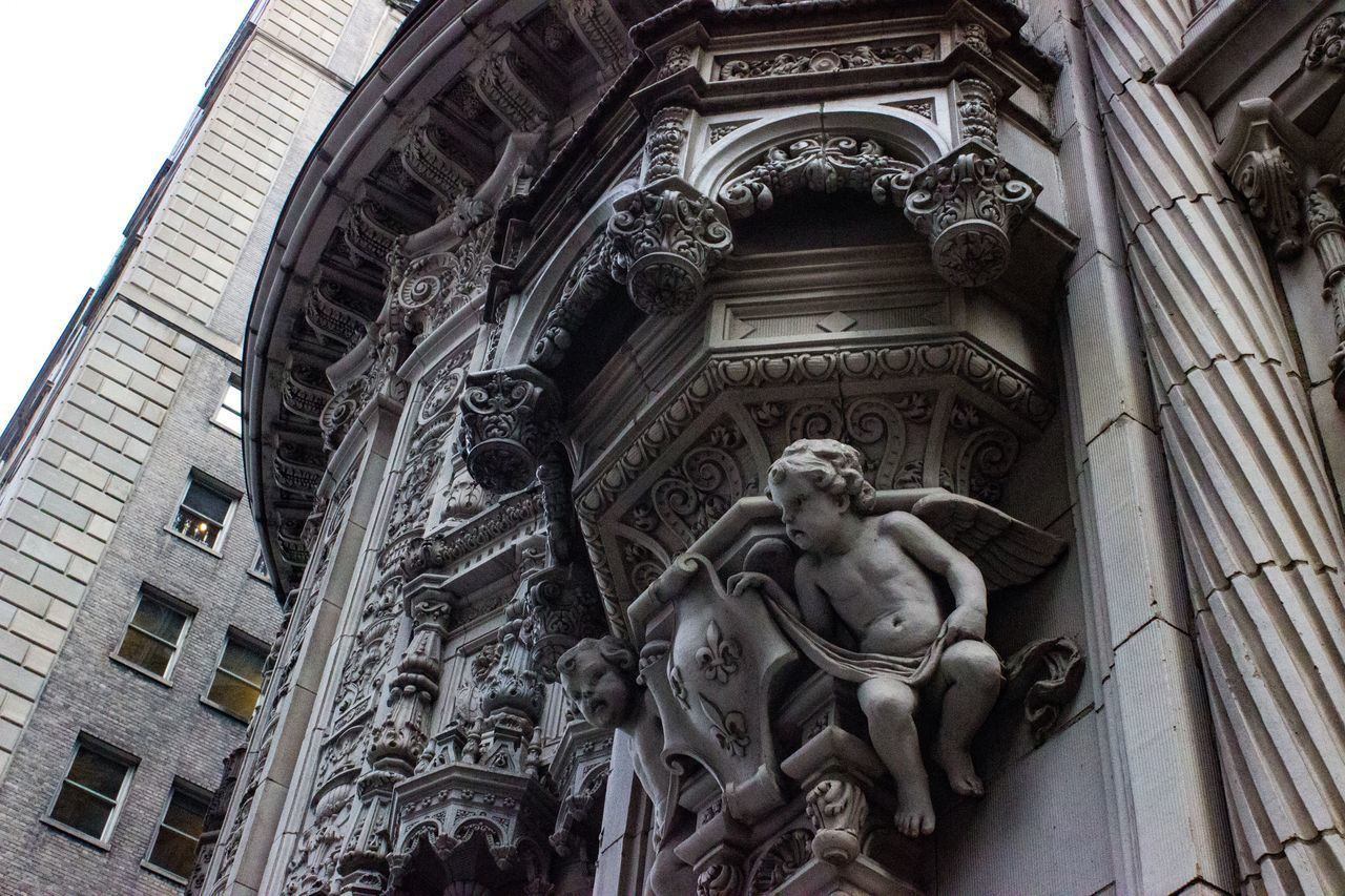 LOW ANGLE VIEW OF STATUES ON BUILDING