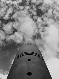 Low angle view of building against cloudy sky